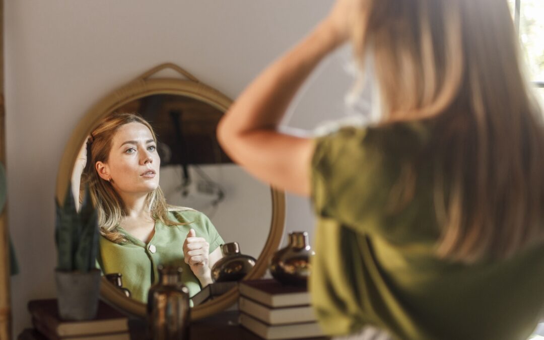 Woman looking in mirror