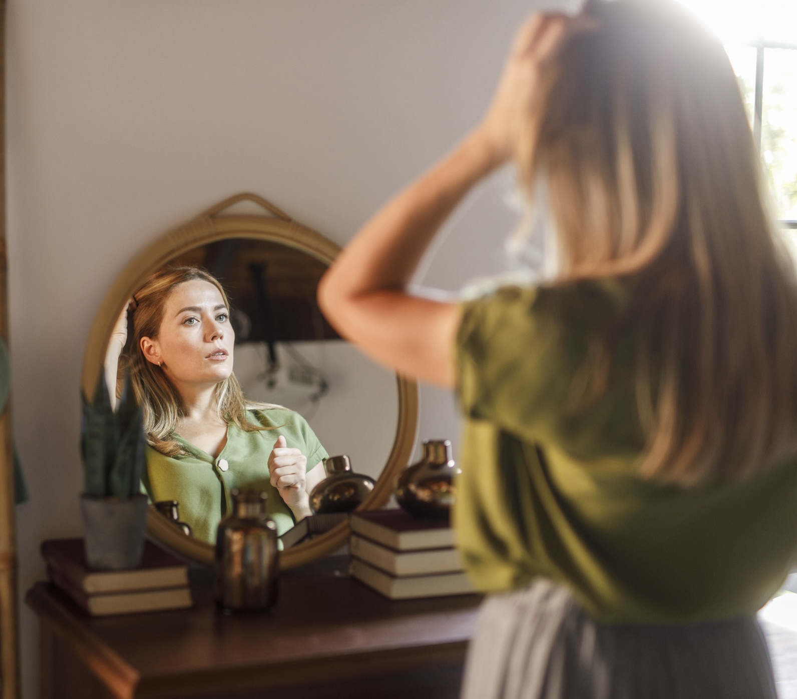 Woman looking in mirror